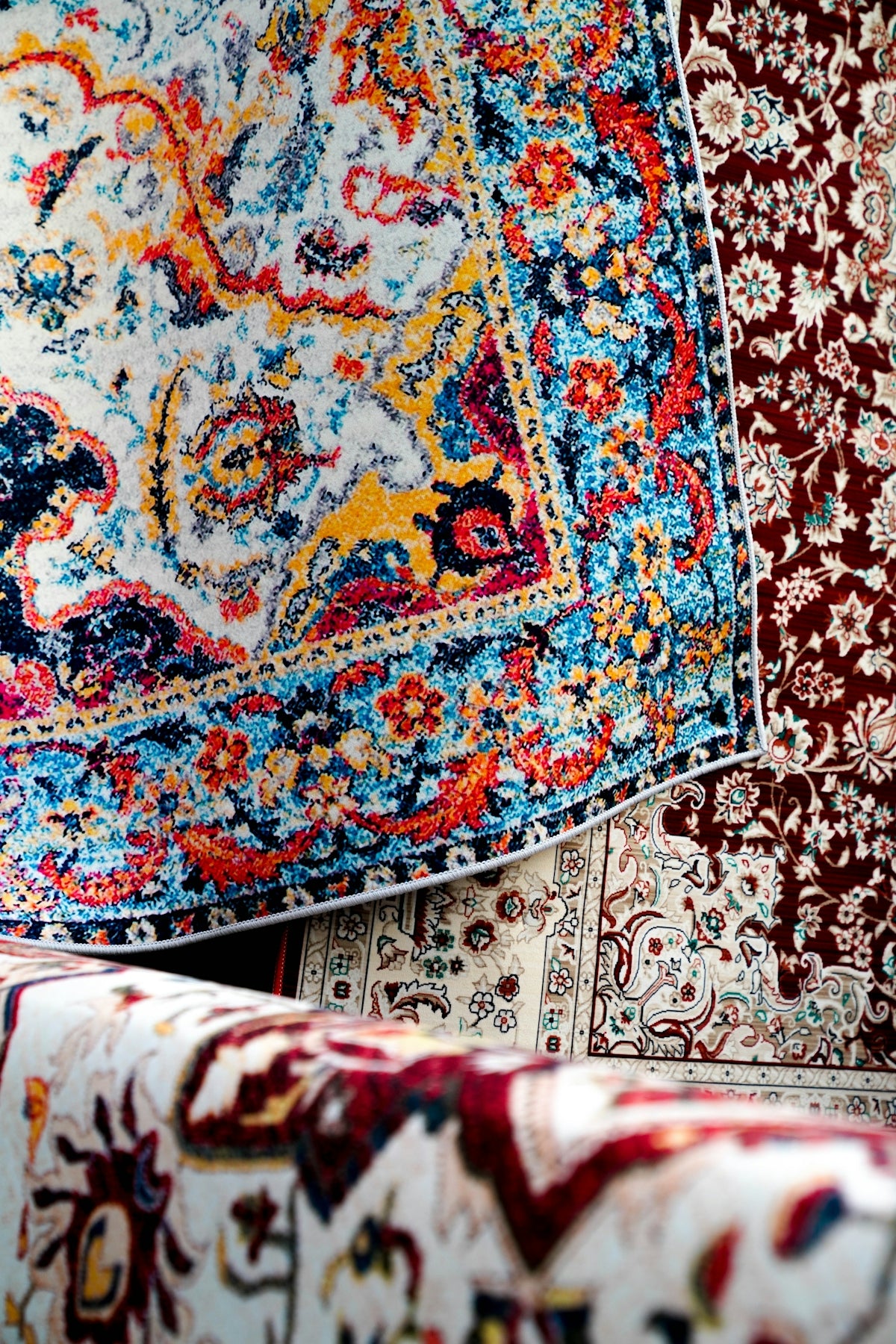 Colorful rugs are stacked for display